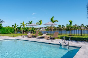 Welcome to "The Palm View House" and it's amazing backyard with heated pool!