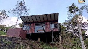 A modern, two-story building with a flat roof and large windows. - Hotel Selva Negra (Guatapé)