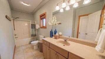 Combined shower/tub, towels, soap, shampoo