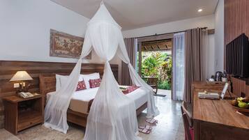 Suite with Garden View | Minibar, in-room safe, iron/ironing board, free WiFi