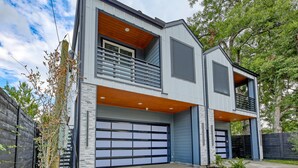 A modern two-story house with a garage, a balcony, and a stone facade. - "Stunning Home New Listing in the shadows of Downtown Houston A must SEE" (Houston)
