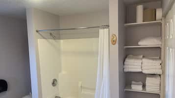 Combined shower/tub, towels, soap, toilet paper