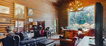 Waterfront cabin with private hot tub, beach access & river views - dog-friendly