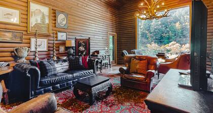 Waterfront cabin with private hot tub, beach access & river views - dog-friendly