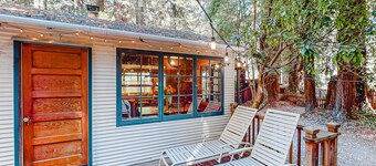 Classic cabin steps to river, beach - private hot tub & fireplace - dog-friendly