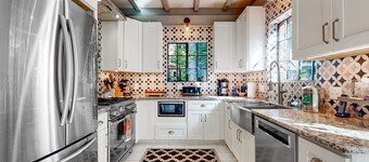 Stunning riverfront estate with hot tub, dock, & fireplace - dog-friendly