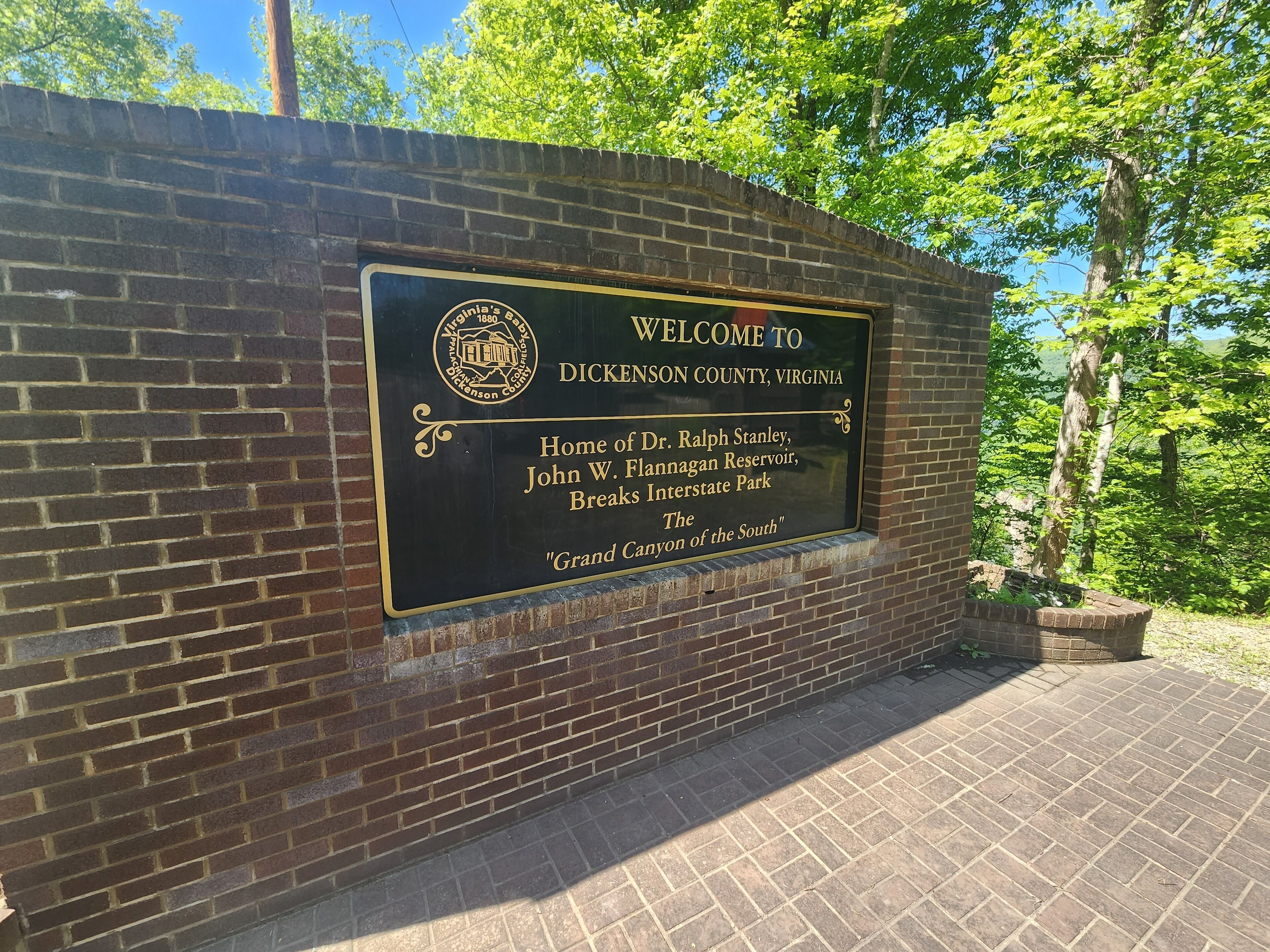 A welcome sign at Dickenson County, Virginia, mentioning Dr. Ralph Stanley and John W. Flannagan Reservoir.