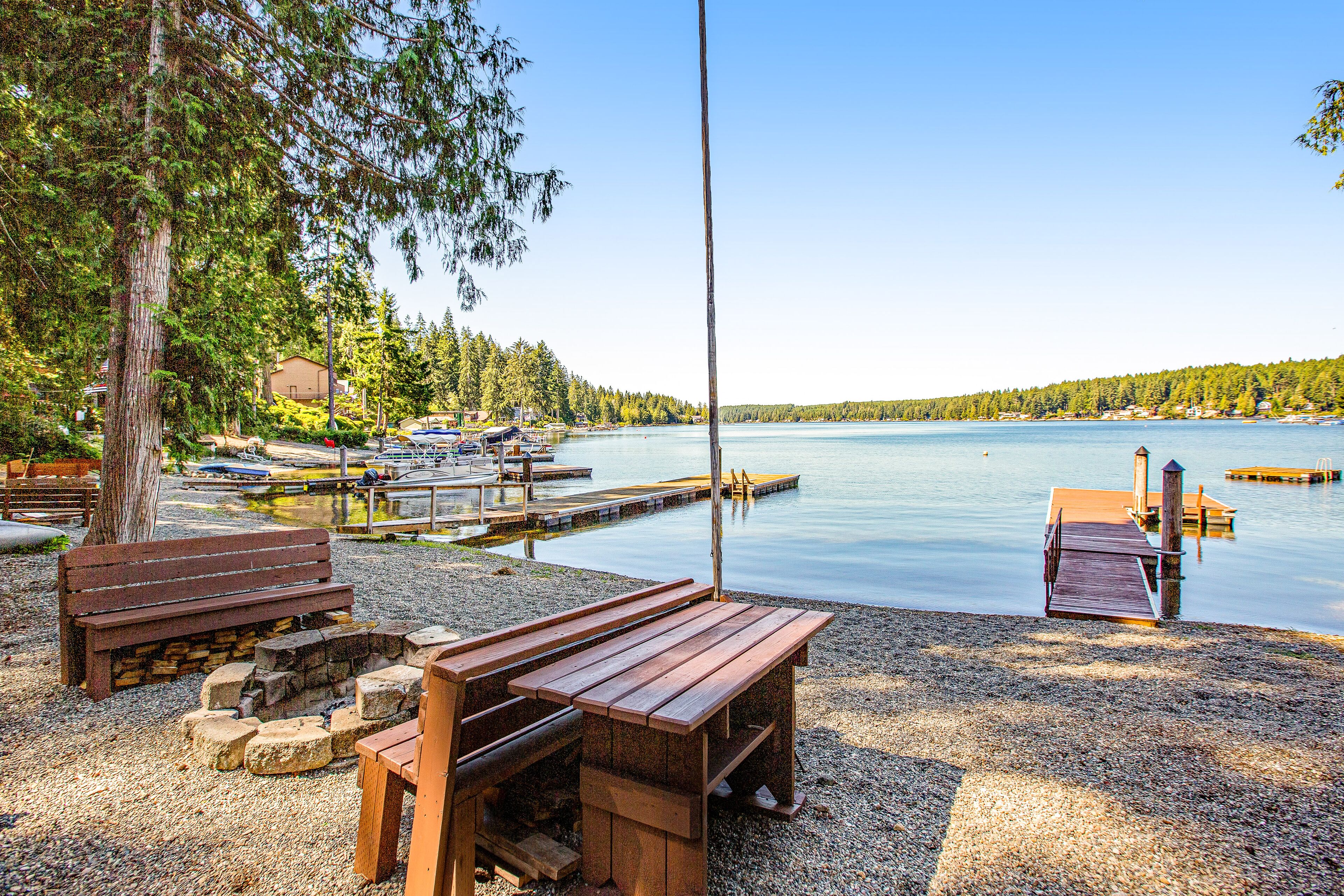 Lakefront home with beach access, a firepit, washer/dryer & fireplace