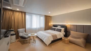 Premium bedding, desk, laptop workspace, blackout curtains