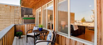 Downtown loft + studio with water/city views, 2 full kitchens, & free WiFi