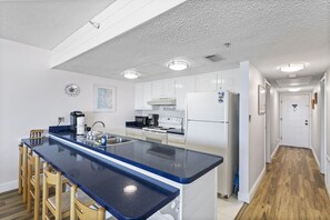 Fridge, microwave, oven, stovetop - 🌴 Coastal Charm Meets Panoramic Beachfront Views – 2BR Corner Unit in Indian Rocks Beach (Indian Rocks Beach)