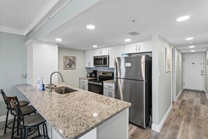 Fridge, microwave, oven, stovetop - 🌴 Gulf Front 2BR Condo with Direct Pool Patio Access & Stunning Views Sleeps 6 –  Indian Rocks Beach (Indian Rocks Beach)