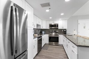 Fridge, microwave, oven, stovetop - 🌅 Unit 114 – Largest 1BR Gulf Front Condo with Direct Pool Deck Access & Stunning Views - Indian Rocks Beach (Indian Rocks Beach)