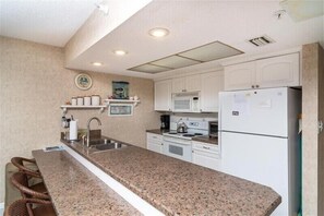 Fridge, microwave, oven, stovetop - 🌊 Elegant Gulf Front 2BR Condo with Sunlit Patio & Spacious Coastal Comfort Sleeps 6 – Indian Rocks Beach (Indian Rocks Beach)