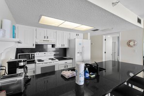 Fridge, microwave, oven, stovetop - 🌊 Gulf & Intracoastal Views from Your Private Wraparound Balcony - Indian Rocks Beach (Indian Rocks Beach)