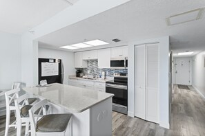 Fridge, microwave, oven, stovetop - 🌅 Sunrise Serenity from Your Private Balcony – Renovated Intracoastal Condo 1BR  Sleeps 4 Fifty Gulfside – Indian Rocks Beach (Indian Rocks Beach)