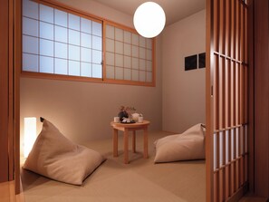 Two-Bedroom Japanese Suite | Living area | 40-inch flat-screen TV with digital channels, TV, toys