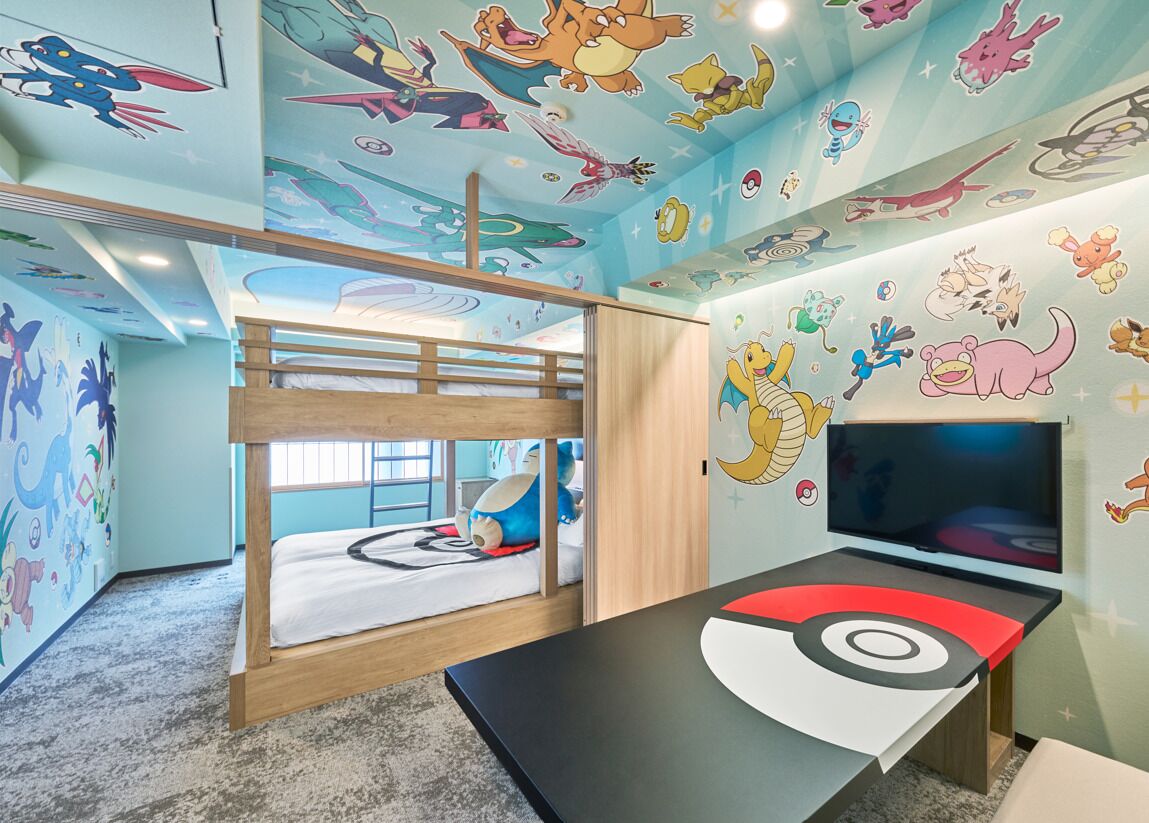 A children's room with a bunk bed, a TV, and Pokémon-themed decorations.