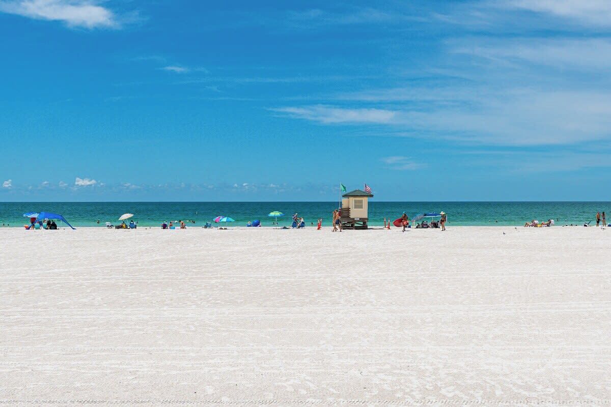 On the beach, sun loungers, beach towels