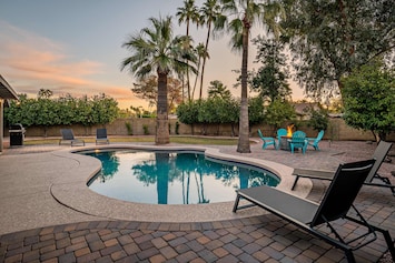 Lovely Arizona backyard with lounging areas and a beautiful pool.