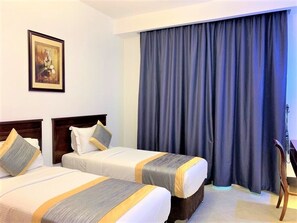 1 غرفة نوم ومكواة/لوح كي وملاءات أسرّة