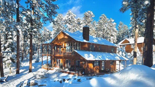 A wooden cabin surrounded by snow-covered trees. - Luxury Home on 8 Acres - Fantastic Views and outdoor space - 20 Min to DGO (Durango)