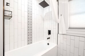 Combined shower/bathtub, hair dryer, towels, soap