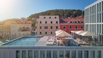 Seasonal outdoor pool, pool umbrellas, sun loungers