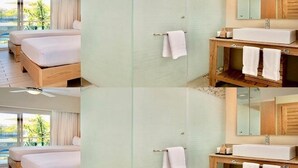 A hotel room with a bed, a bathroom with a sink and mirror, and a view of the outdoors. - Luxurious 1 Bedroom Tropical Junior Suite (Dominican Republic)
