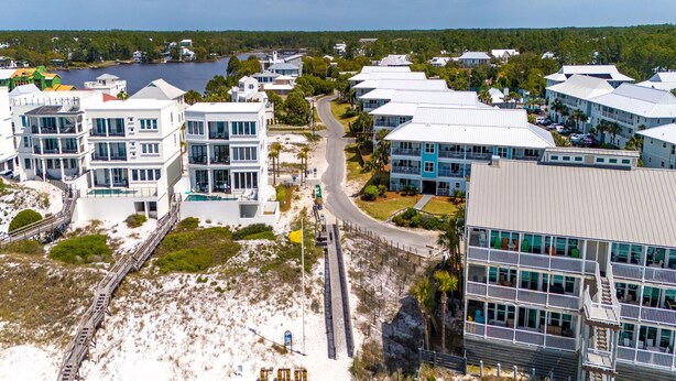 A coastal hotel with multiple buildings, a beach access road, and a view of the ocean. - Beachside Villas #413 | Pet-Friendly Condo, Near Beach with Pool (Seagrove Beach)