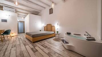 Deluxe Double Room | Minibar, in-room safe, desk, iron/ironing board