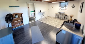 Cozy retreat with a compact kitchenette, dining area, and comfortable seating.