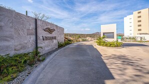 A modern building with a stone wall entrance labeled "Vistamar." - Punta Serena | Los Tules Oceanview Penthouse Condo (Residencial Los Tules)