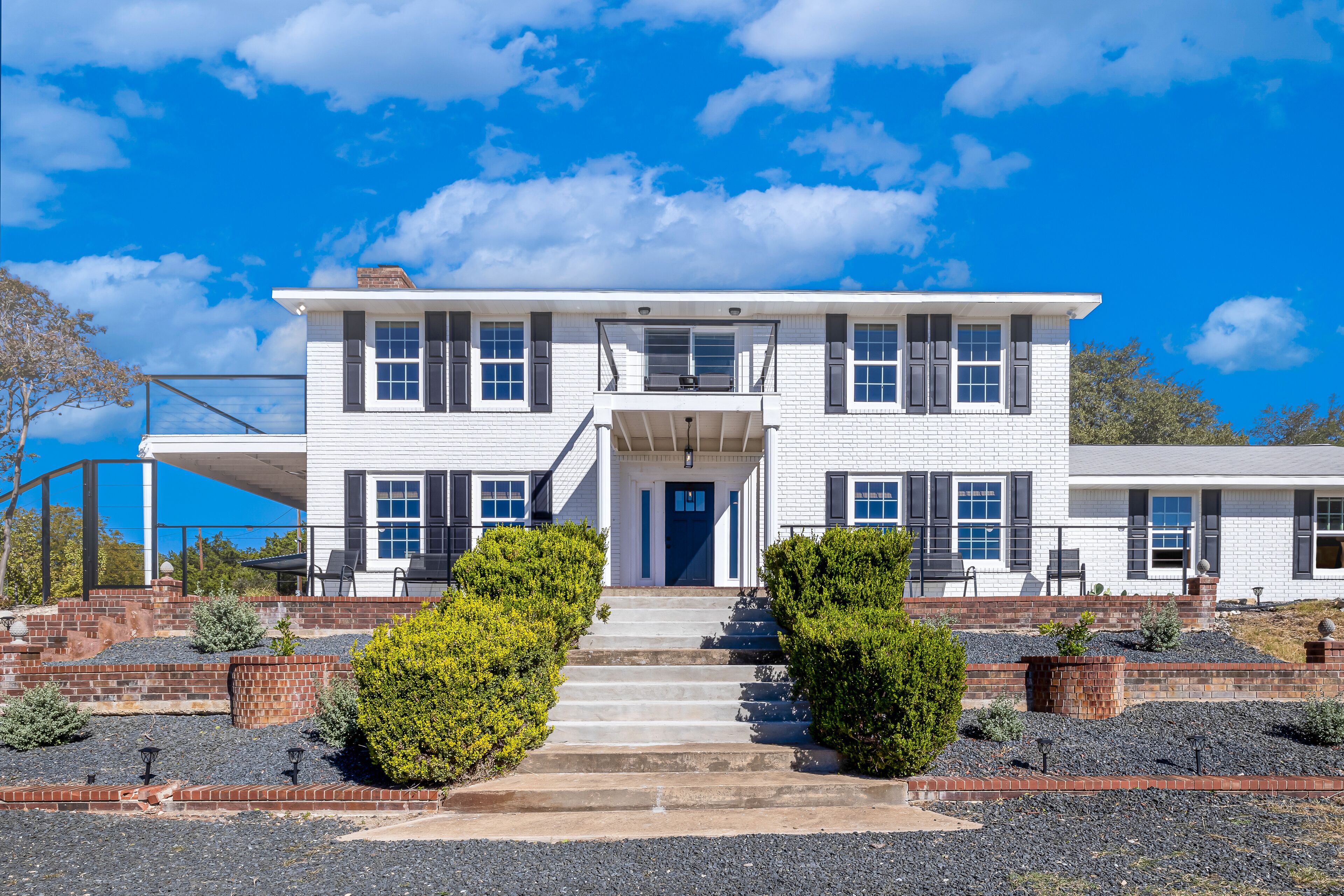 Modern home overlooking Texas Hill Country with private pool, hot tub & decks