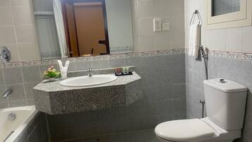 Standard Apartment | Bathroom | Rainfall showerhead, free toiletries, hair dryer, slippers