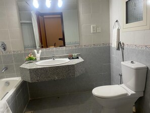 Standard Apartment | Bathroom | Rainfall showerhead, free toiletries, hair dryer, slippers - Wanasa Continental Hotel (Muscat)