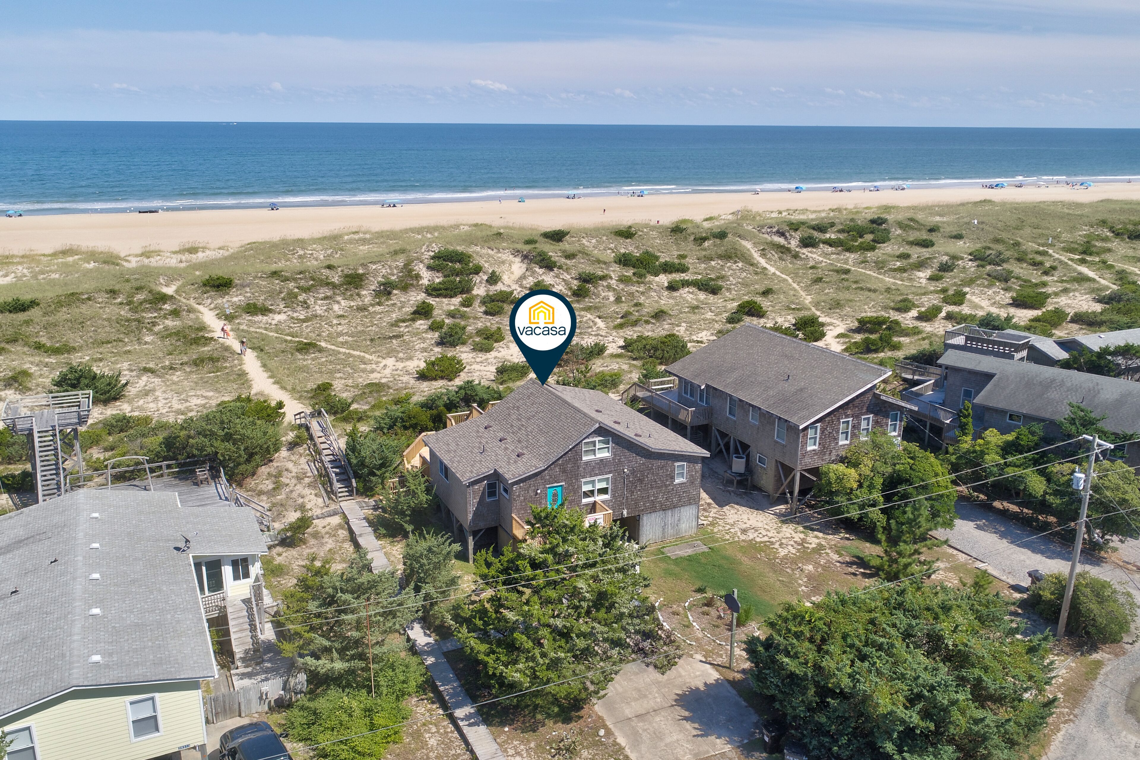 OBX beach house with ocean views, decks, private hot tub, & seasonal pool access