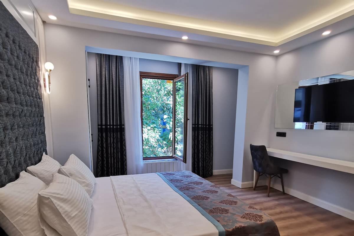 Chambre Deluxe Double ou avec lits jumeaux | Bureau, espace de travail pour ordinateur portable, Wi-Fi gratuit