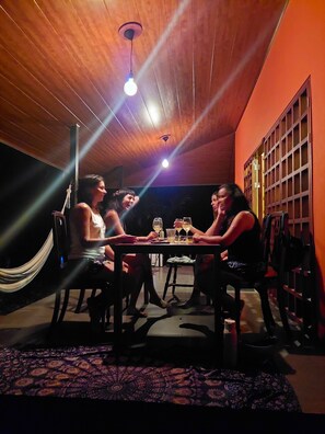 Guests can dine in this cozy space with a hammock nearby.