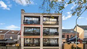A multi-story building with large windows and balconies. - Modern apartment with garage box and free wifi (Willebroek)