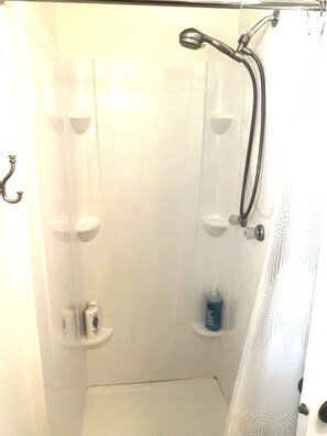Combined shower/tub, hair dryer, towels, soap