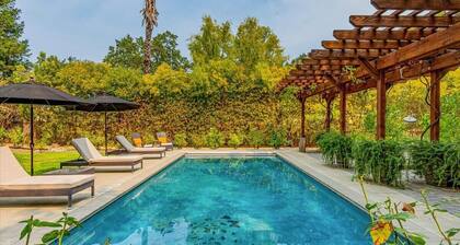 Modern farmhouse on the edge of town with pool.