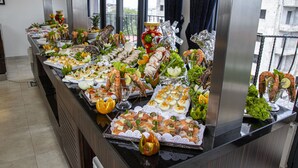 A buffet with various food items including seafood, salads, and appetizers. - Souare Premium Hotel (Conakry)