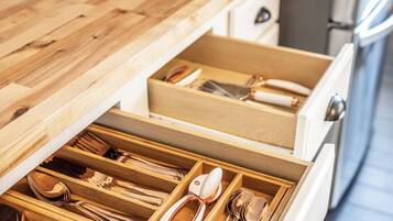 Fridge, dishwasher, coffee/tea maker, cookware/dishes/utensils