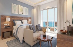 Ett modernt hotellrum med en stor säng, en soffa, ett soffbord i trä och utsikt över havet.