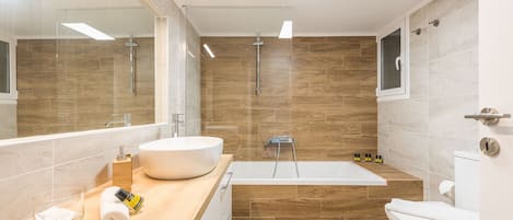 Bathtub, hair dryer, soap, shampoo
