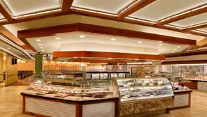 A buffet area with multiple glass display cases filled with food items. - Beautiful 2 Double Bedroom (Harrah's Laughlin) (Laughlin)