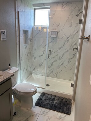 Combined shower/tub, hair dryer, towels, soap