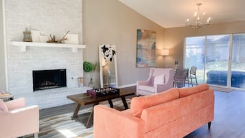 Smart TV, fireplace, table football, books