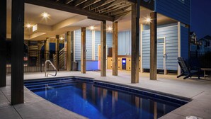 A swimming pool with a wooden deck and a covered area with pillars. - Waterfront Home with Panoramic Views in Black Dog Harbor, Salvo, NC  (Salvo)